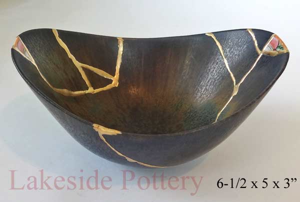Kintsukuroi art - Yobitsugi style repair using other ceramic pieces