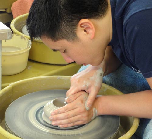 hands-on teaching - pottery wheel class in session
