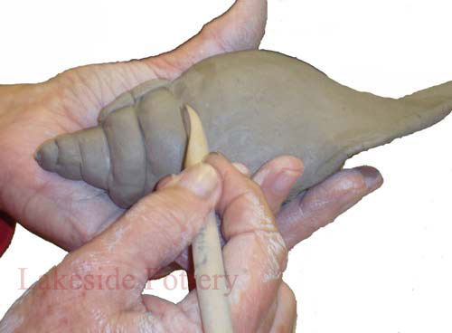 sculpting seashell with clay