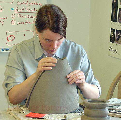 obstract clay sculpture - class in session
