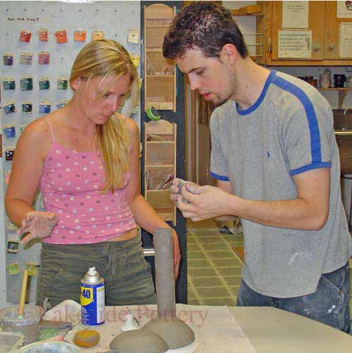 hand building instructor and student