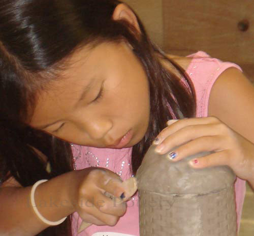 Girl making a bird feeder