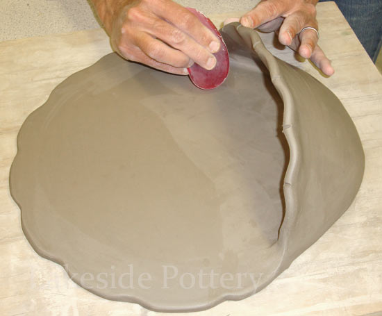 making clay holy water font