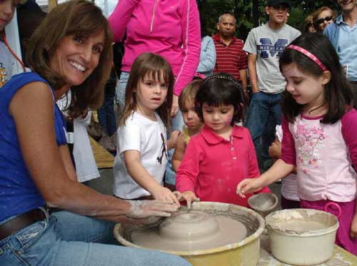 Stamford, Southern CT Art and Craft fair with children and adults trying pottery
