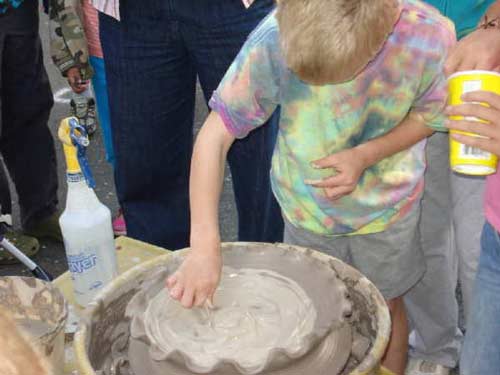 Stamford, Southern CT Art and Craft fair with children and adults trying pottery