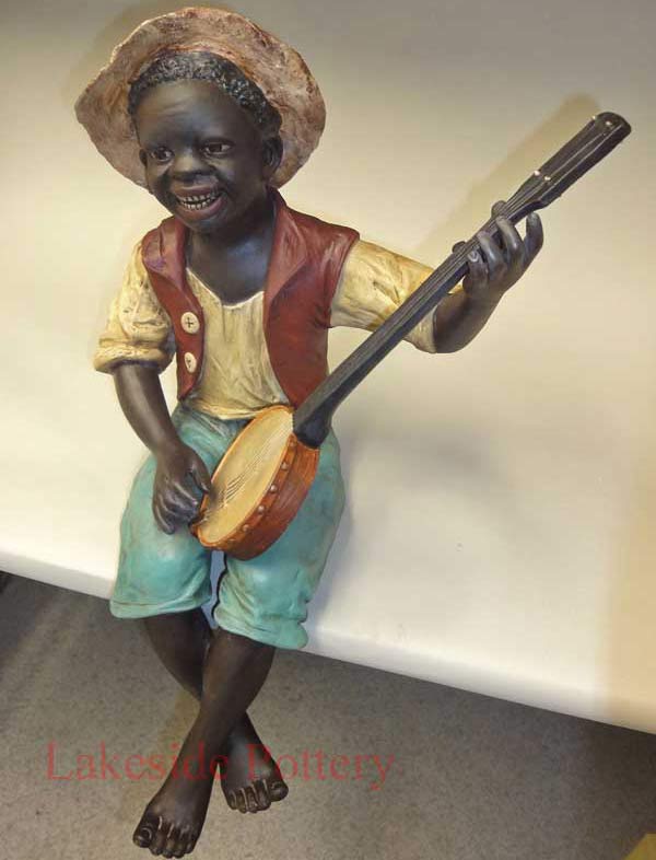 Terra Cotta African boy statue repaired