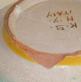 Missing ceramic pieces at bowl's foot