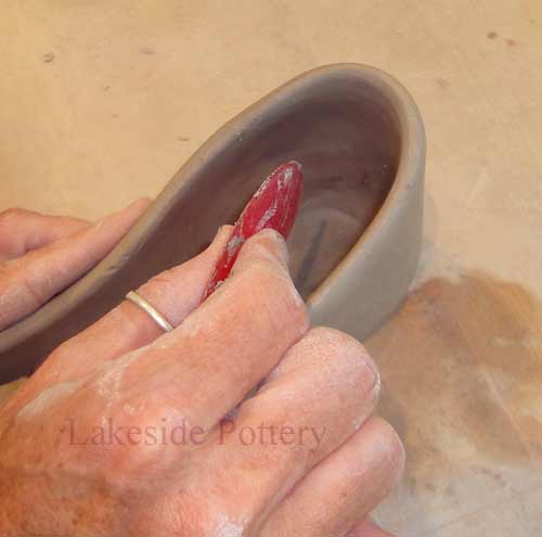 adjust shape of the clay with a soft rib 
