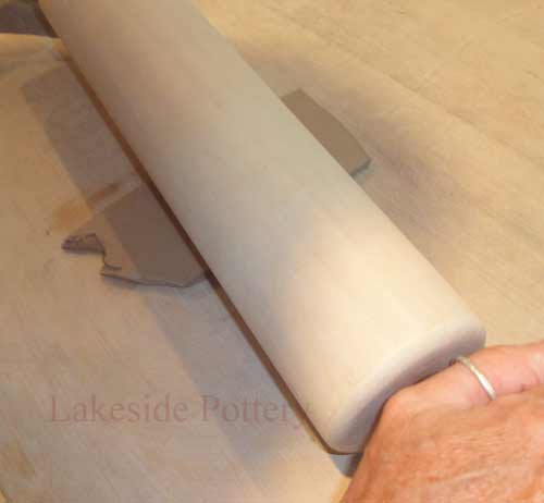 use rolling pin to thin clay slab