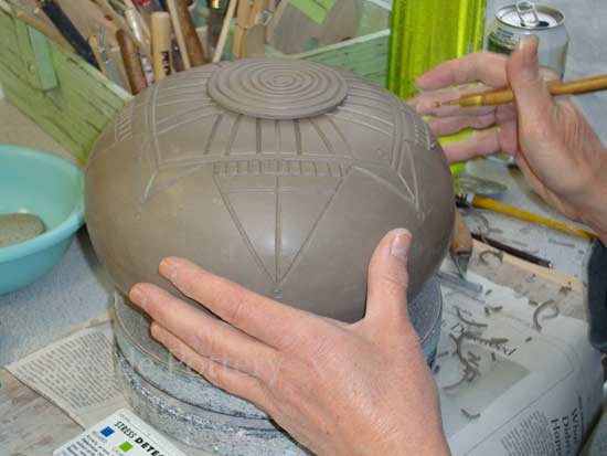 carving surface texture on hand built clay project