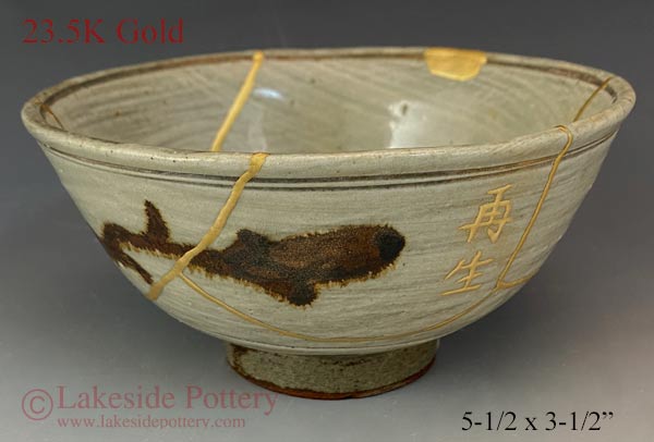 Antique Japanese ceramic kintsugi bowl restored with gold. Antique