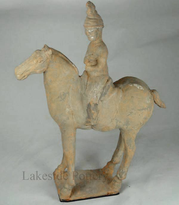 Repaired old chinese terracotta statue - horse and rider