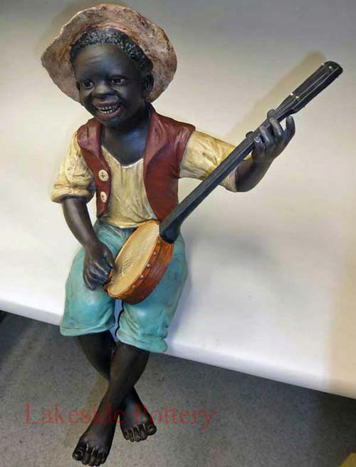 Large african boy statue repaired