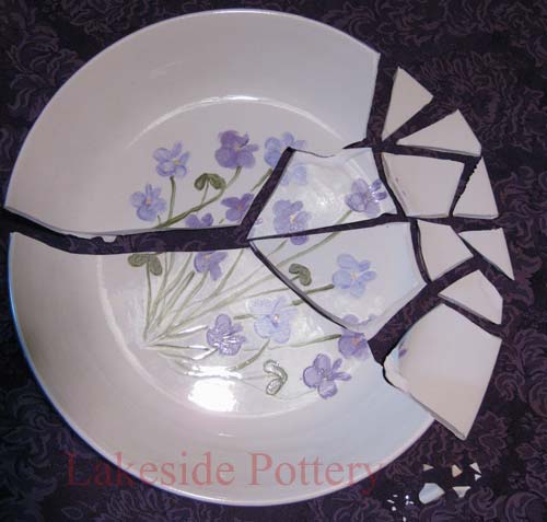Broken ceramic hand painted bowl