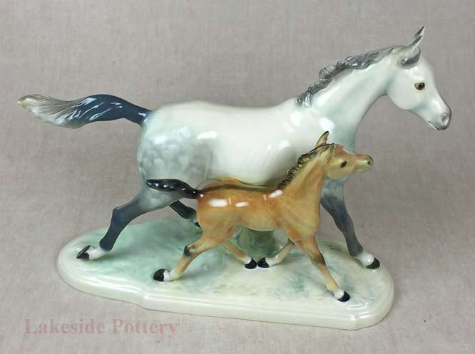 Repaired ceramic horse and foal figure