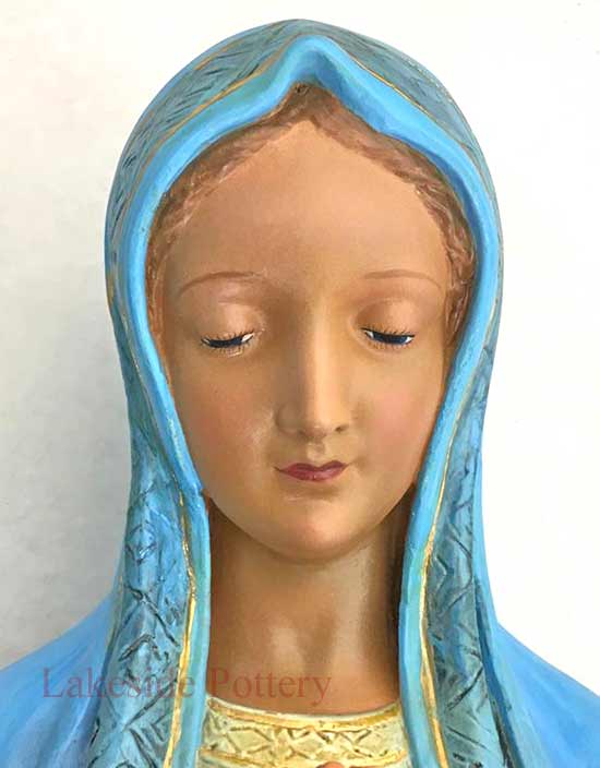Plaster religious statue restored