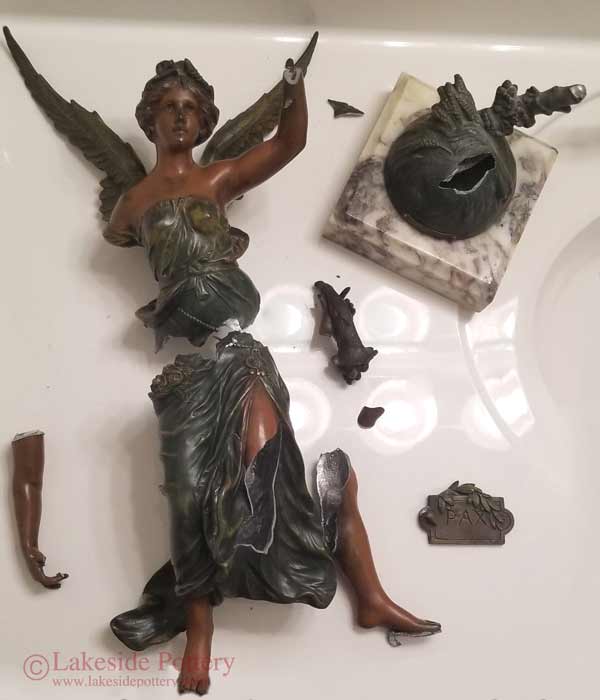 Spelter angel statue broken