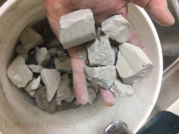 Add to clay scrap bucket and let it get completely dry before adding water. Drying may take several days to over a week