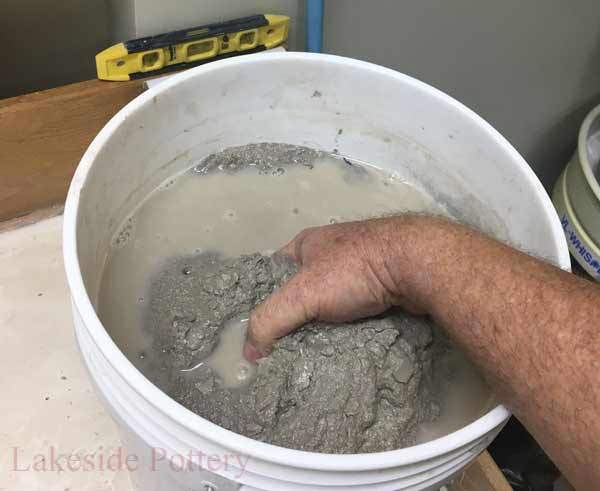 A couple of days later, once the slurry feels smooth, remove the clay slurry to a drying surface