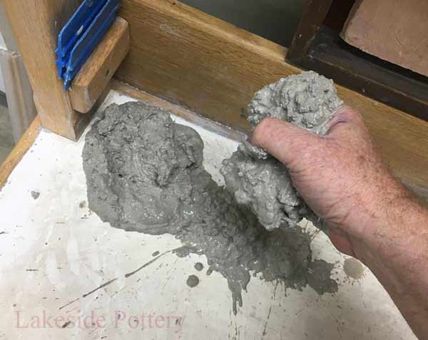 Transfer the clay from the bucket to a porous surface and allow to dry (we use our plaster wedging table)