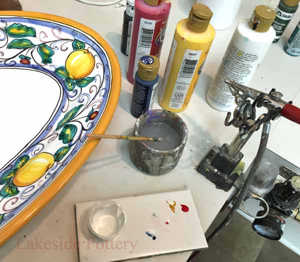 Mix acrylic paints to match background off-white color