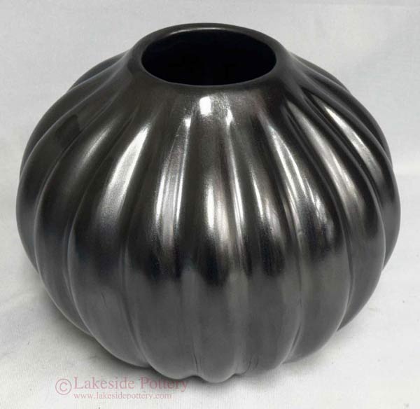 Completed restoration of Native American pit-fired burnished pottery with recreated surface behavior