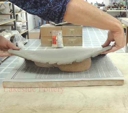 Lay slab on stockings or tights with rice