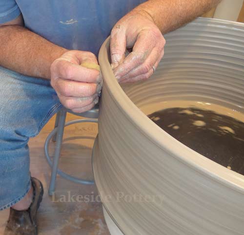 Throwing a very large bowl on the wheel lesson