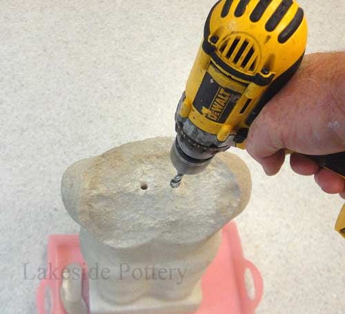 drilling holes in sculpture