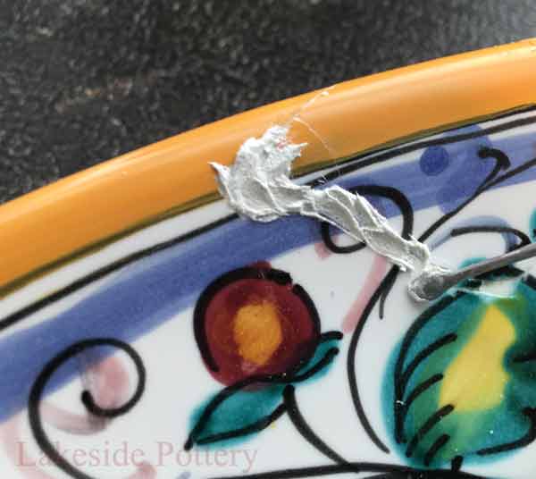 Apply thin layer of filler while pushing in to fill cracks and missing fragments