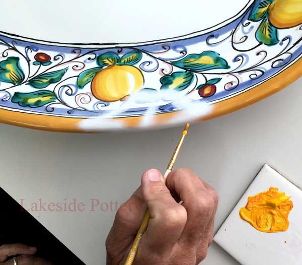 Use fine brushes to apply color